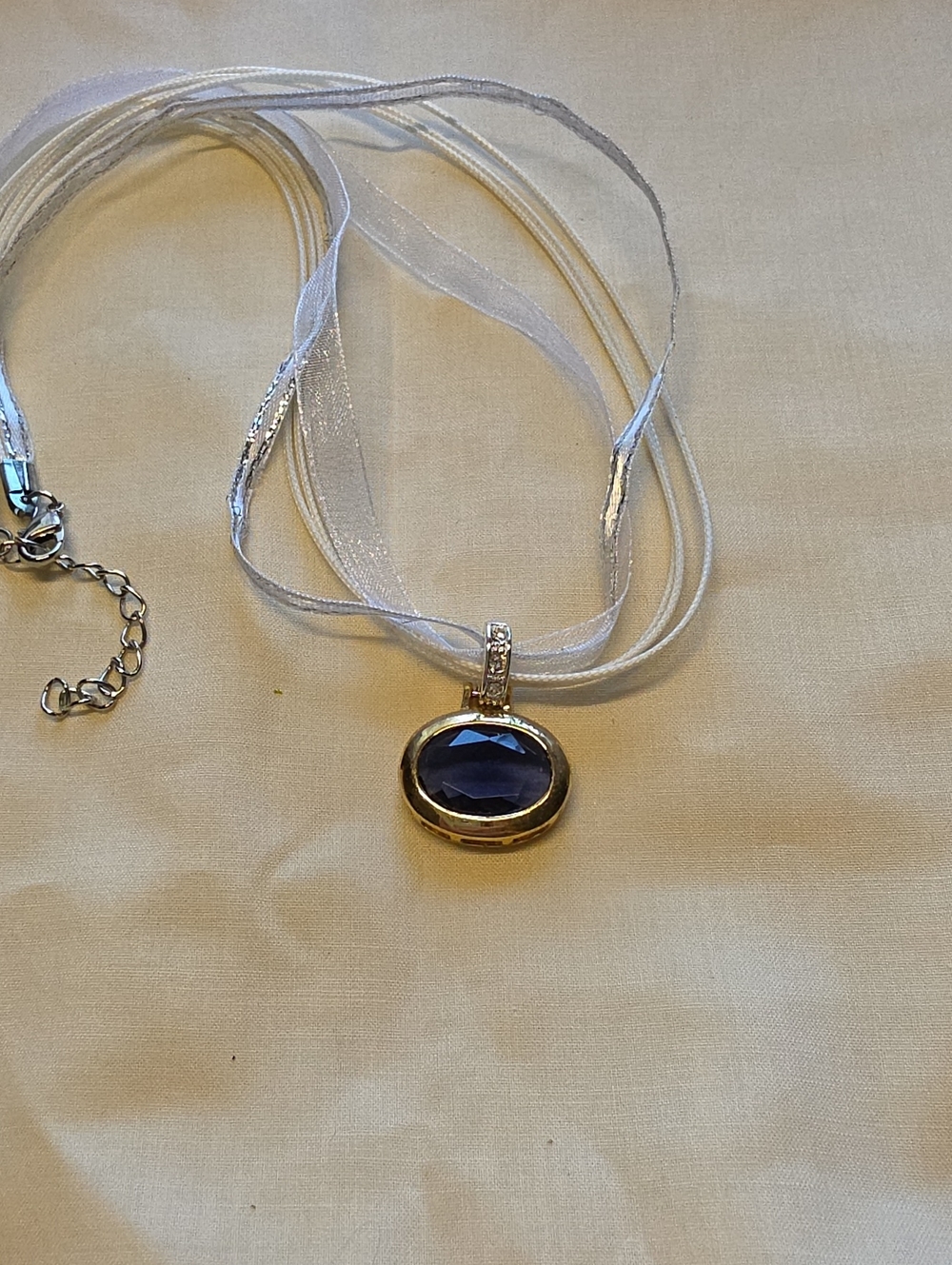Silver Ribbon Necklace with Deep Blue Oval Gem Pendant